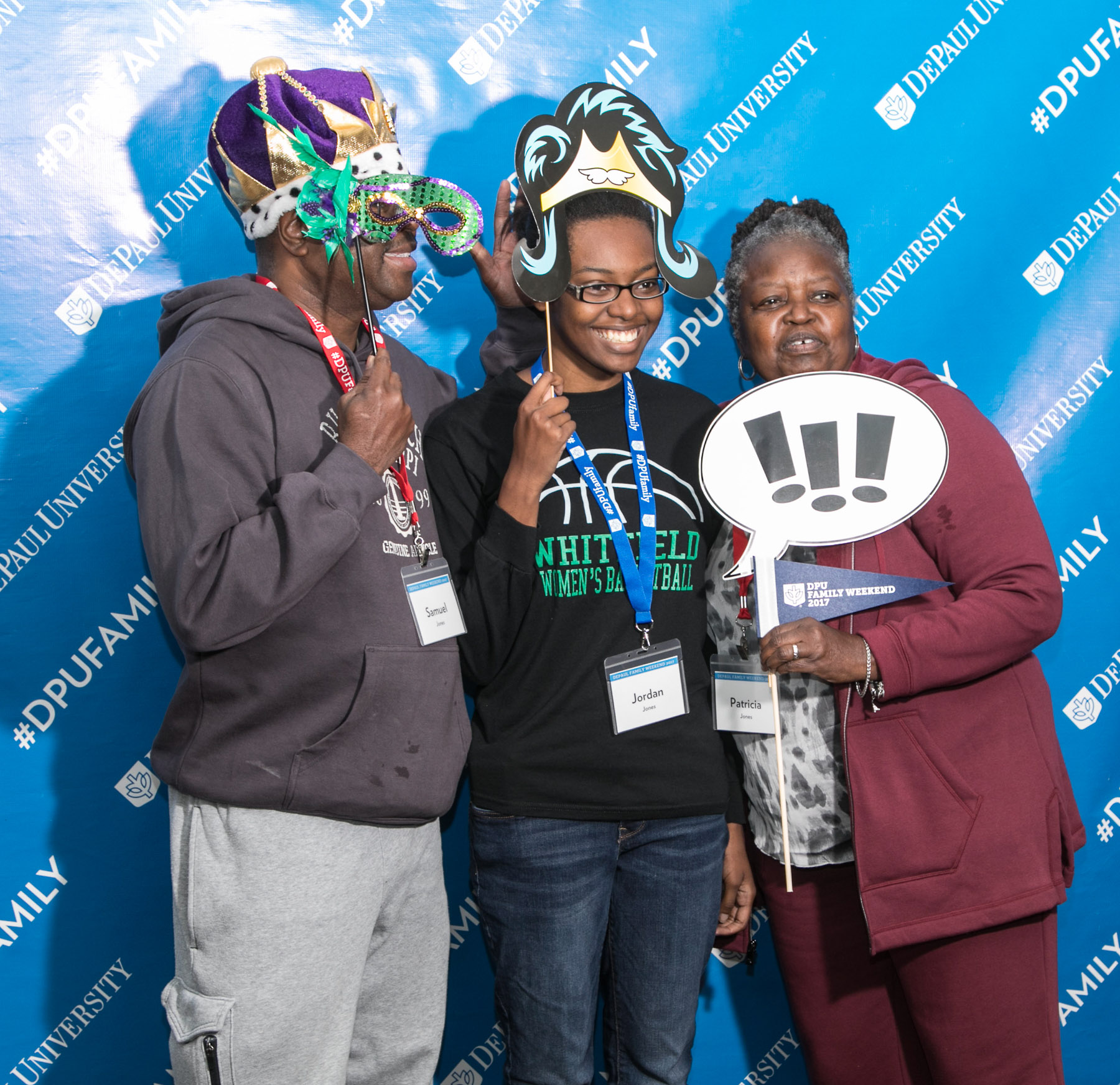 Sam, Jordan and Patricia Jones, left to right, pose for a photo as DePaul students and family members arrive at the Family Weekend Kickoff celebration. (DePaul University/Jamie Moncrief)